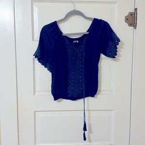 Boho indigo can crop blouse with lace detail.